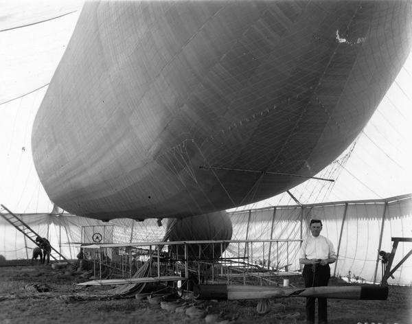 The first dirigible purchased by the U.S. Army and its builder, Thomas A. Baldwin.