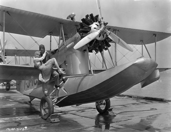 Publicity shot for "Flying Fleet," an MGM motion picture release starring Ramon Navarro and Anita Paige. The Navy aircraft on which the actors are posed is a Loening Amphibian, while the less obvious product placements in the shot are the Hamilton propellers manufactured by the Hamilton Aero Manufacturing Company of Milwaukee.