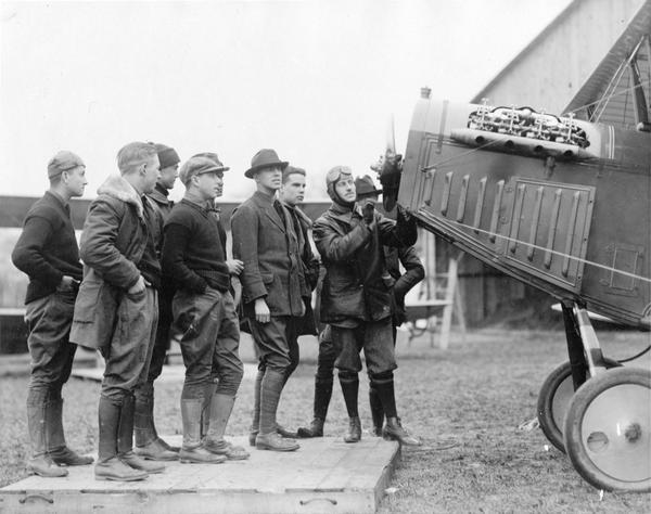 A ground school conducted by Princeton University for students who wished to enlist in the Army Air Service. During World War I most American aviators were college students, although the best known flyer, Eddie Rickenbacker, was not. Here an Air Service officer demonstrates the correct way to start the propeller on a trainer airplane. The Curtiss JN-4, or Jenny, as it was commonly known, was used for training in the United States, but not for combat.