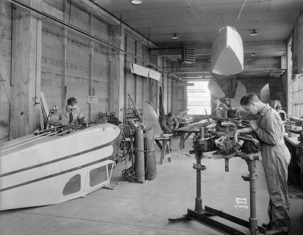 The repair shop of the Morey Airplane Company at Royal Airport in Madison. Only months after this picture was taken, Howard Morey lost both his hangar and his airplane in a fire. Morey had established this airport, originally known as Pennco Field, in 1926. After the fire Morey returned to barnstorming and charter work, and in 1938 he became the manager of the new Madison Municipal Airport.