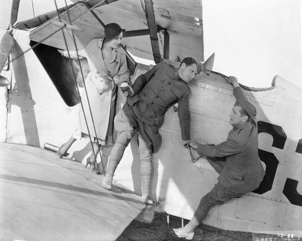 Spencer Tracy in "Sky Devils," Howard Hughes's silly World War I comedy. Tracy (center) and William Boyd play two inept stowaways who end up on a ship that was taking aviators to Europe. With them in this scene is Ann Dvorak. It is likely that the vintage airplanes used in the film are planes that Hughes purchased for his 1930  film "Hell's Angels."