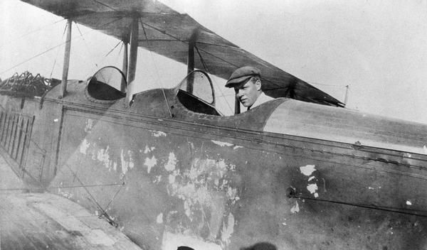 Roy Larson of Larsen, Wisconsin in his first plane, a Canadian-built Curtiss (Canuck) purchased in 1922. Shortly after making this purchase, Roy and his brothers, Leonard, Newell, and Clarence, established Wisconsin's most famous rural airport on their family farm.
