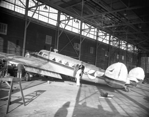 A Beechcraft 18 in the former Air Force hangar at Truax Field. This photograph was taken shortly after Wisconsin Central Airlines moved its headquarters from Clintonville to Madison.