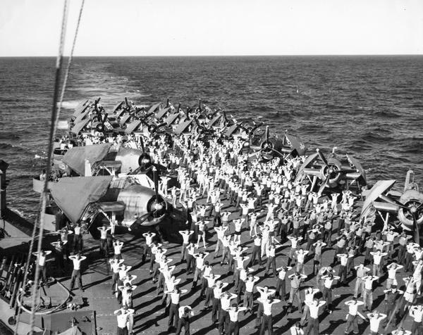 Physical exercise aboard an aircraft carrier during World War II.  This photograph was a part of a scrapbook compiled by Philip F. La Follette, former governor of Wisconsin and press aide to General Douglas MacArthur, from official photographs that came to his desk. 
