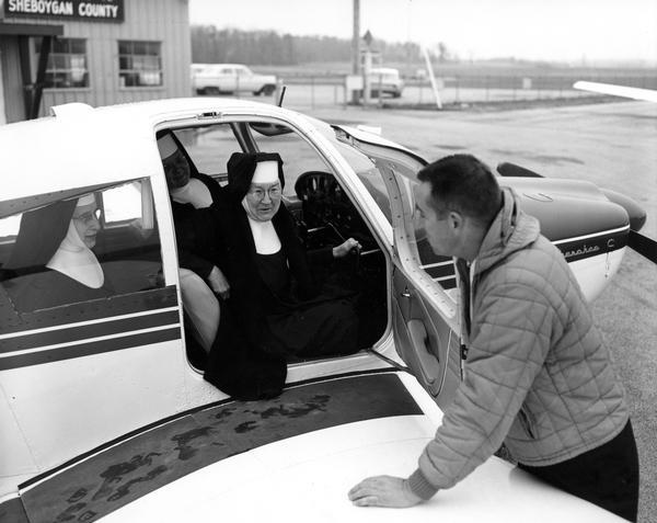 The real flying nun, Sister Mary Aquinas Kinskey, arriving at Sheboygan County Airport with two Franciscan sisters in a Cherokee C airplane. Sister Mary Aquinas, whose mother house was in Manitowoc, learned to fly during World War II in order to teach her students. Later she was involved with pre-flight instruction for the military. After the war she continued to fly, and she introduced aviation into the science curriculum in schools in Wisconsin and elsewhere.