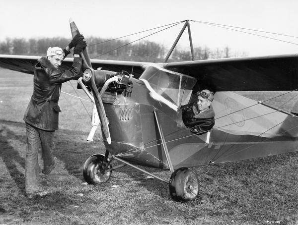 Fritz Warden (at the propeller) and Lee Barney, two young members of the Waukesha Flying Club, together with Barney's Aeronica C2 airplane.  The Aeronica was a small, lightweight, easy-to-operate sport plane with a fabric shell. Because they were also relatively inexpensive, Aeronicas were popular during the 1920s and 1930s.  Neil Armstrong is said to have learned to fly in one.