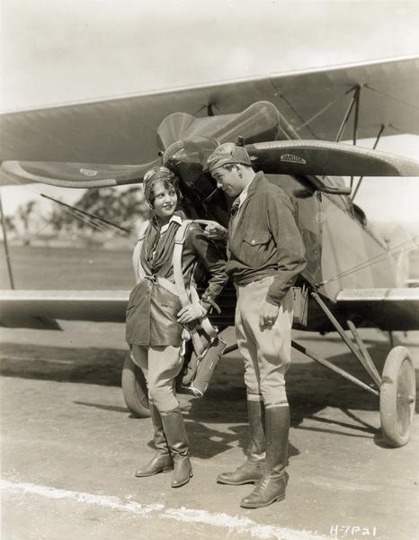 "Air Circus" (Fox 1928) is the story of two flight school cadets (only David Rollins is pictured) and an accomplished aviatrix, Sue Carol, who can fly rings around them. This motion picture is notable as the first of Howard Hawks's many aviation films. Originally part-talkie, "Air Circus" is now available only in its silent version. And what is the product placement? The propellers were manufactured in Milwaukee by the Hamilton Aero Manufacturing Co.