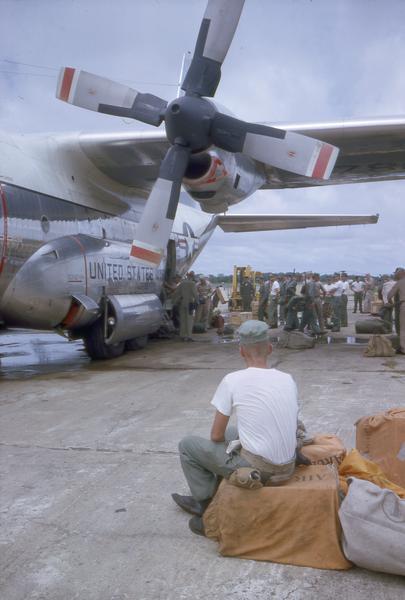 Marines arriving at Soc Trang on a C-130 Hercules transport carrier.  Soc Trang was an abandoned landing strip built by the Japanese during World War II.  
The C-130s were designed to move troops and equipment rapidly to remote locations, and they were used extensively during the Vietnam War.  This photograph was taken by Milwaukee free-lance photographer Dickey Chapelle whose collection is available for research at the Wisconsin Historical Society Archives.