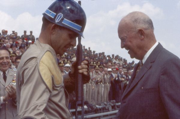 President Dwight D. Eisenhower (Ike), as commander-in-chief, inspects a soldier at an exhibition at Fort Benning.