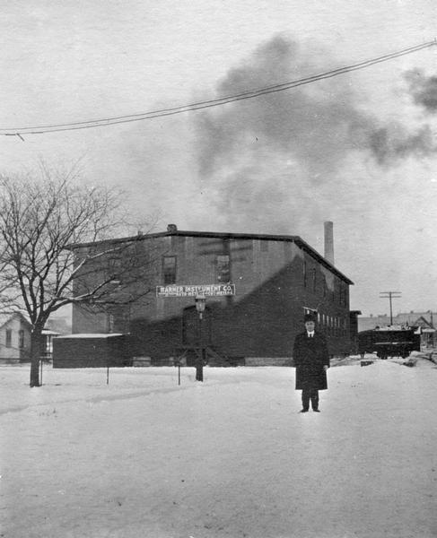 Arthur Pratt Warner, Wisconsin's first aviator, in front of the office of the Warner Instrument Company in Beloit. Warner, who held the patent for an automobile speedometer, was similar to many early aviation enthusiasts in that he loved machines and automobiles. Warner became acquainted with the Aerial Experiment Association which included Alexander Graham Bell and Glenn Curtiss, through aviation inventor August Herring whose shop was across the street from Warner's New York City branch. The plane that Warner purchased for $6000 in 1909 was the third built airplane by Curtiss.