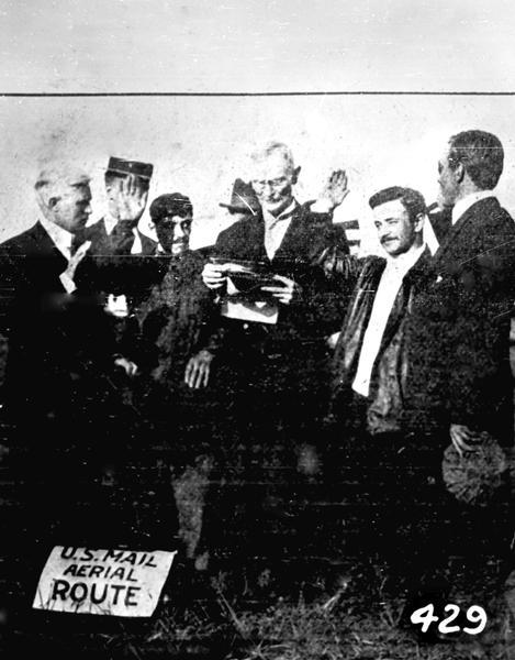 The first airmail shipment from Cicero Field to Wheaton and Elmhurst, Illinois. Postmaster MacDonald of Cicero is swearing-in pilots Max Lillie, Paul Studensky, and Marcel Tournier. Pioneer aviator Jesse Brabazon from Delavan, Wisconsin, who owned the album from which this photograph was copied, recalled attending the event and helping to carry mail bags to Max Lillie's Wright Model B.