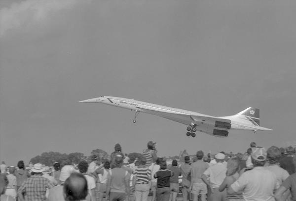 A Concorde begins its takeoff, like a giant bird over the crowd at the Experimental Aviation Association Fly-in.