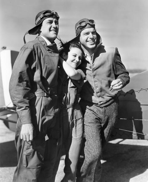 Beaver Dam's favorite son Fred MacMurray (right) co-starred with Ray Milland and Louise Campbell in "Men with Wings," a 1938 Paramount release that traced the early history of aviation through the lives of the stars. "Men with Wings" was produced and directed by William A. Wellman, a former World War I pilot. Like Wellman's earlier aviation film ("Wings"), "Men with Wings," was characterized by footage of aerial combat.