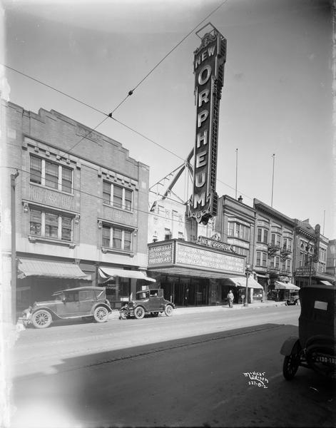 The Orpheum Theatre, 216 State Street. The view also includes Weber's Restaurant, the Family Shoe Store, Rennebohm's Drug Store, and the Madison Theater. The featured photoplay is "Wolf's Clothing."