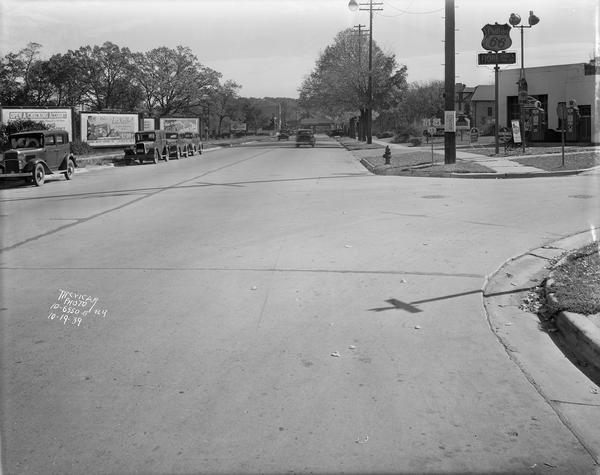 Looking east on University Avenue from the intersection at Grand Avenue. Samuel Fiore's Phillips 66 service station, 2549 University Avenue is on the right.