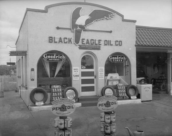 Black Eagle Service Station, 1039 East Washington Avenue, featuring Goodrich tires and batteries and Pennzoil. Text with print reads: " Don Gallagher & Co. — Black Eagle Oil Co., 907 S. Park Street or 1039 East Washington Avenue."