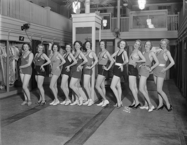 Eleven Fanchon & Marco show girls model bathing suits at Heller's, 205 State Street.