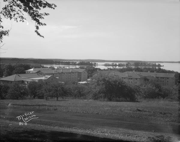 View across Observatory Drive, looking down towards the Van Hise dormitories: Adams, Tripp, and Carson Gulley Commons. Picnic Point is in the distance on Lake Mendota.