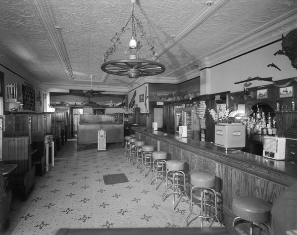 Stan Cutler's Bar X Tavern interior, 123 East Main Street, the bar and booths have a Western theme.