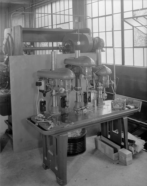 Three Delta Company drill presses on display at the Scanlan Morris Company, 1902-1948 East Johnson Street.