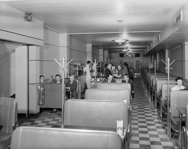 Manchester's Department Store Fountain Room and coffee shop, with people at the counter and in booths.