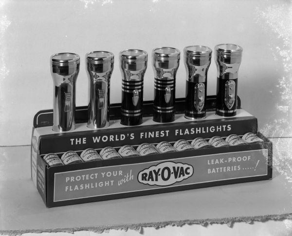 Display of six Ray-O-Vac flashlights and batteries.