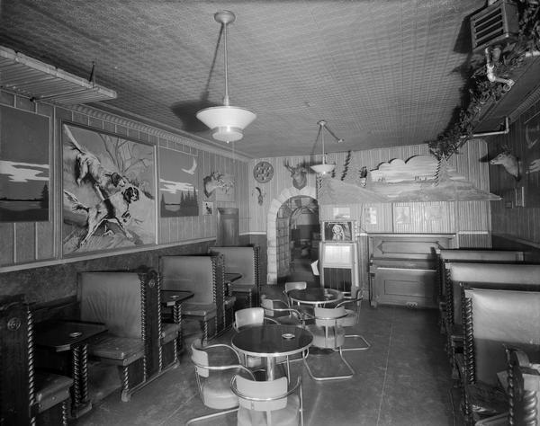 Dutch Tavern, 121 North Blount Street, with piano, jukebox, tables, booths, and northwoods decor.