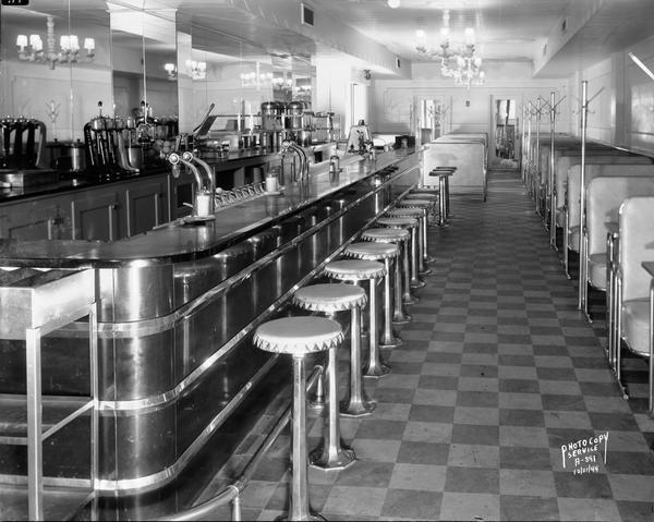 View of the booths and lunch counter in the Fountain Room restaurant at Manchester's Department Store.
