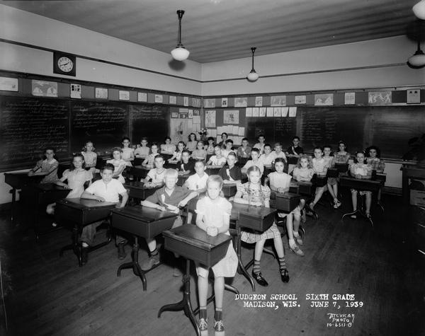 Group portrait of sixth grade students sitting at their desks at Dudgeon School, 3200 Monroe Street.