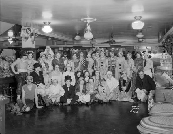 Employees of the W.T. Grant Company, 21 S. Pinckney Street, in costumes at their Halloween party.