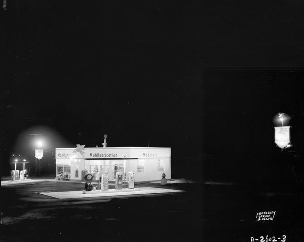Night view of Robert Blossom's Mobil Gas Station, 3702 East Washington Avenue and Highway 51.
