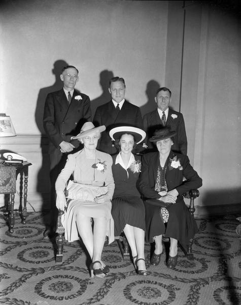 Group portrait of bride Arlene Tiedeman and groom Edward Jankowski, University of Wisconsin and Green Bay football star, with their parents Mr. and Mrs. Frank A. Tiedeman and Mr. and Mrs. William Jankowski. They were married at Blessed Sacrament Church, 2119 Rowley Avenue.