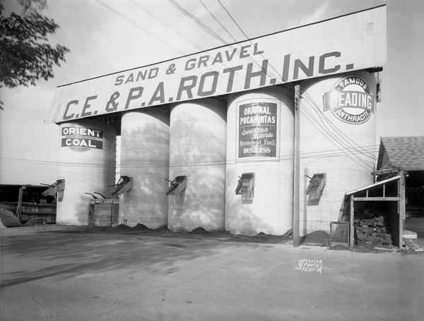 Wide angle view of 5 coal silos at C.E. and P.A. Roth Inc., sand and gravel company, 1208 Roth Street.