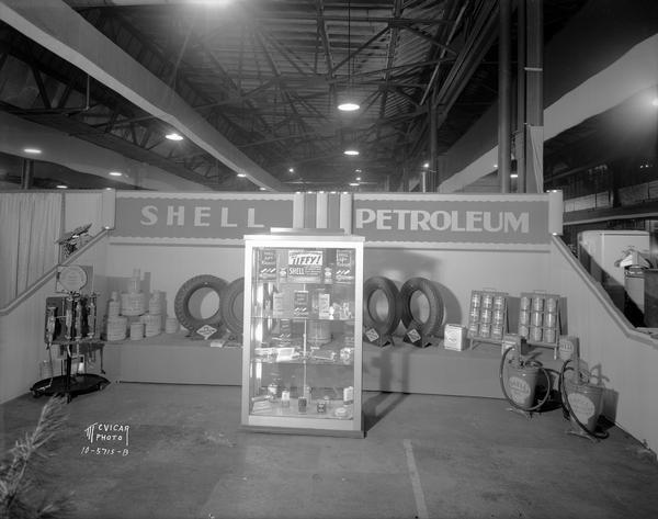 Shell Petroleum Co. display of automobile products at the ESBMA (East Side Business Men's Association) Fall Festival in the Fuller & Johnson building on East Washington Avenue at 51 North Dickinson Street.