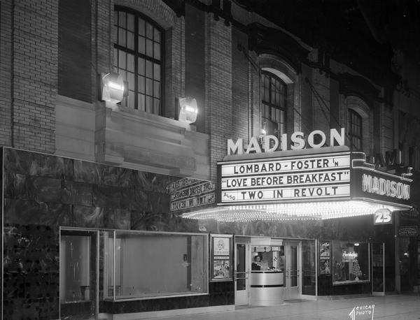 Madison Theatre marquee. "Lombard — Foster in 'Love Before Breakfast,' also 'Two In Revolt'" on the marquee.