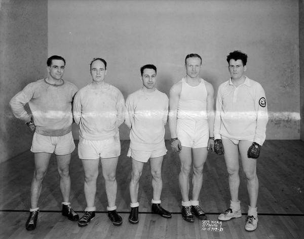 Five YMCA handball champions posing for a group portrait.