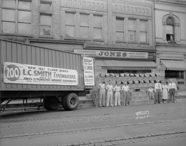 Semi-trailer truck delivering 200 new 1937 super speed L.C. Smith typewriters to Jones Typewriter — Business Furniture Co., 506 State Street.