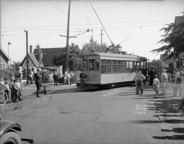 Bus and street railroad accident at Regent and Mills Streets looking east along Regent Street. The DuBois service station at 1 N. Mills Street is in the background.