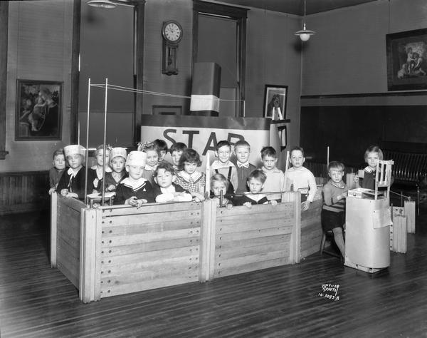 Washington School kindergarten class, 217 N. Broom Street, with children playing in a boat built of blocks.