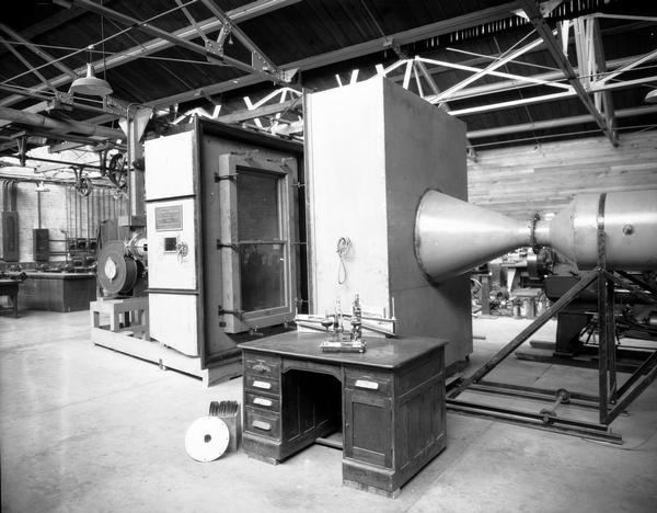 Machine for testing wind leakage through windows and doors, set up at Randall shops, and manufactured by Monarch Metal Products.