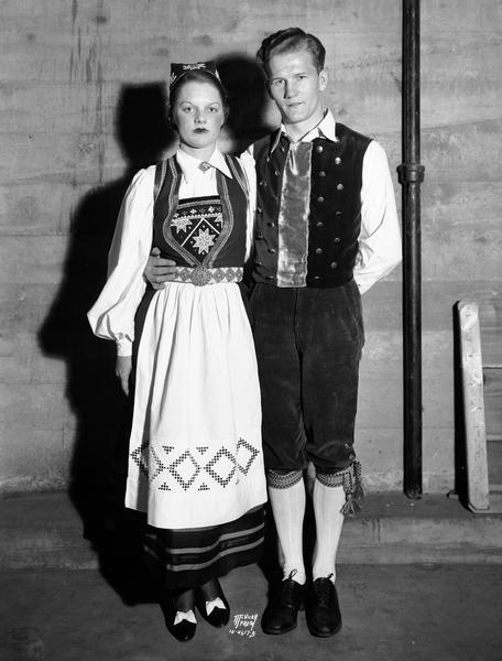 Norwegian folk dancers in costume, Ray Strand and his partner Miss Reison, perform for the Sons of Norway's Syttende Mai celebration. They have been coached by John Odden.