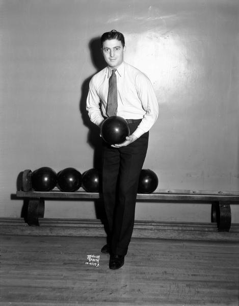 Louis Fiore, Captain of the Phillips "66" team, bowls at Madison Palm Garden and Bowling Alleys, 112 N. Fairchild Street.