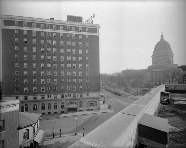 The Belmont Hotel, 31 N. Pinckney Street, from the roof of the Montgomery Ward building, 102 N. Hamilton Street, with the Capitol Square and the Wisconsin State Capitol in the background. Hartmeyer Meats, 101 N. Hamilton Street is in the left foreground.