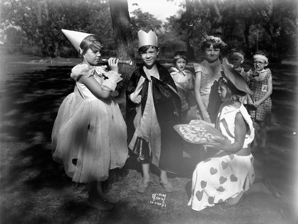 Children in costume as king, queen and attendants at the Kiddie Camp Fair.