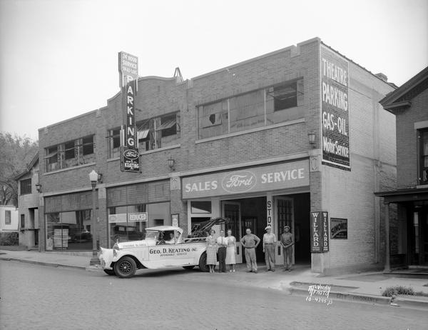 Keating Garage and Ford Sales and Service, 14-16 N. Fairchild Street with the Keating tow truck and employees in front of the garage doors.
