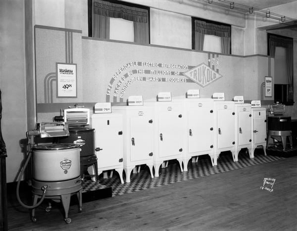 Trukold refrigerators in seven sizes, and Wardway wringer washing machines in three sizes, on display at Montgomery Ward's. "Safe dependable electric refrigeration backed by the millions of Montgomerey Ward's resources."