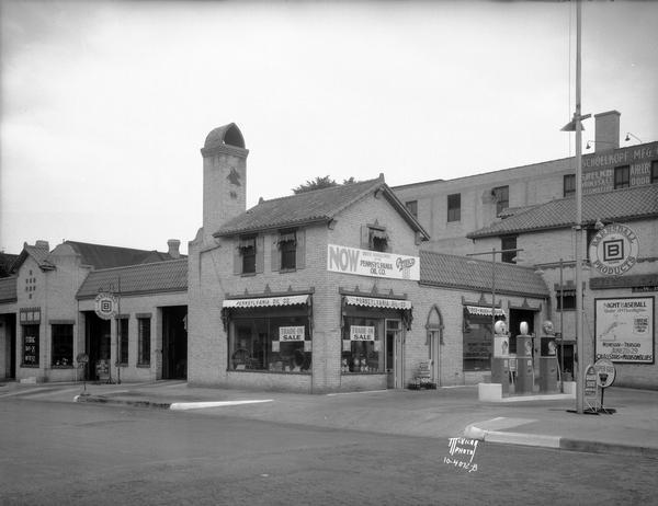 Pennco service station, featuring Barnsdale "Be Square" petroleum products and Dunlop tires, on the corner of N. Webster Street and 202 E. Washington Avenue. Pahl Tire Co. moved into this building about 1960.