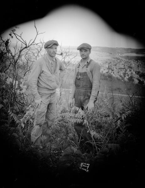 Brothers William Sweeney (right) and Homer Sweeney (left), standing on Coon Rock Bluff.