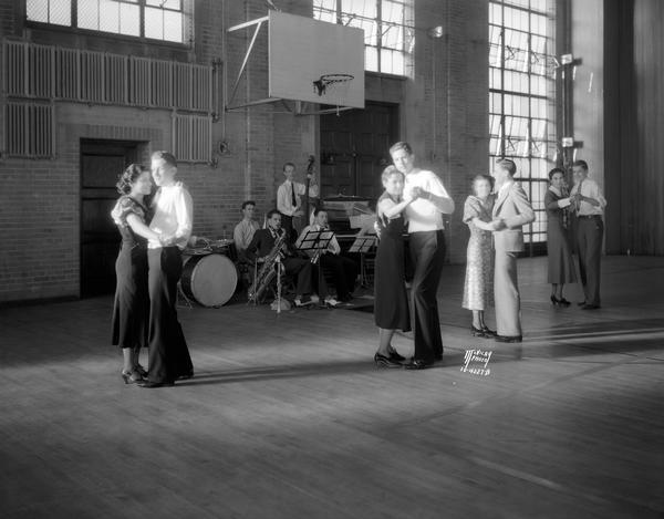 Couples dance to a small band at a matinee dance in the Madison East High School gymnasium.