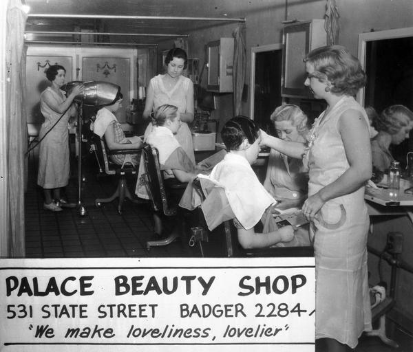 Advertisement for the Palace Beauty Shop, 531 State Street, with a view of beauty operators working with three customers, and the banner: "We make loveliness lovelier."
